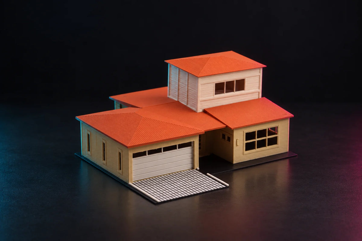 1:64 split-level house diorama with a terracotta tile roof, sand walls, a two-car garage and a tiled driveway