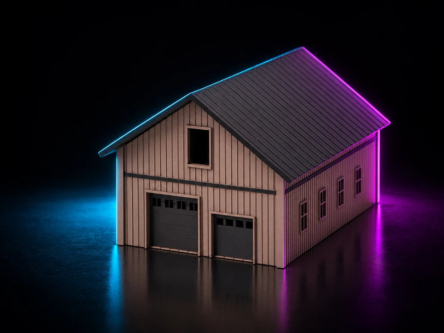 A printed barn in sand board-and-batten with a dark standing-seam gable roof, two vehicle bays and a loft window above them.