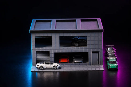 Frame 2 — straight on to the front, the shutter and the ground-floor bay side by side, cars lined up along the forecourt.