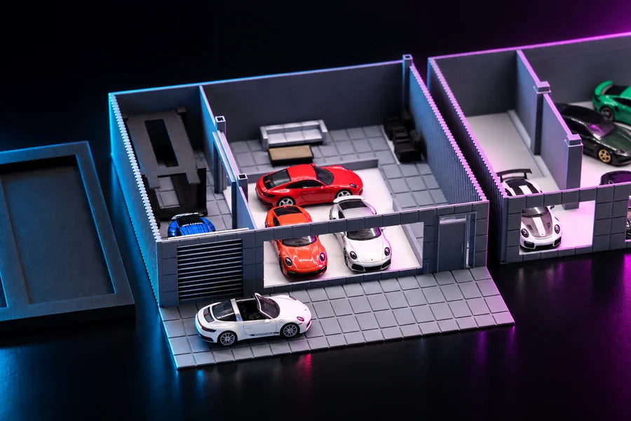 Frame 3 — the upper floor lifted off, the plan from above, cars on the showroom floor and one out on the forecourt.