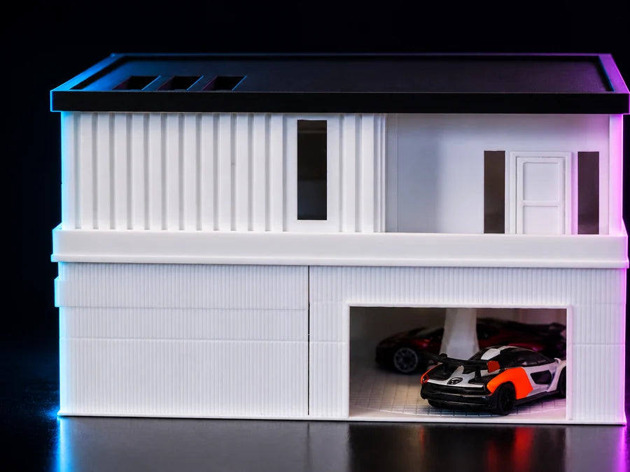 Frame 3 — straight on to the front, the flat roof running the full width and a car standing in the open bay below.