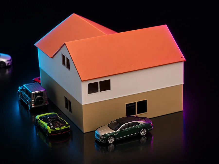 Frame 2 — the three-quarter with the roof on, the gable running back over the garage and four cars standing around the plate.