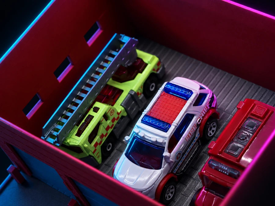 Frame 3 — roof off, four vehicles on the deck and the ladder rack along the wall.