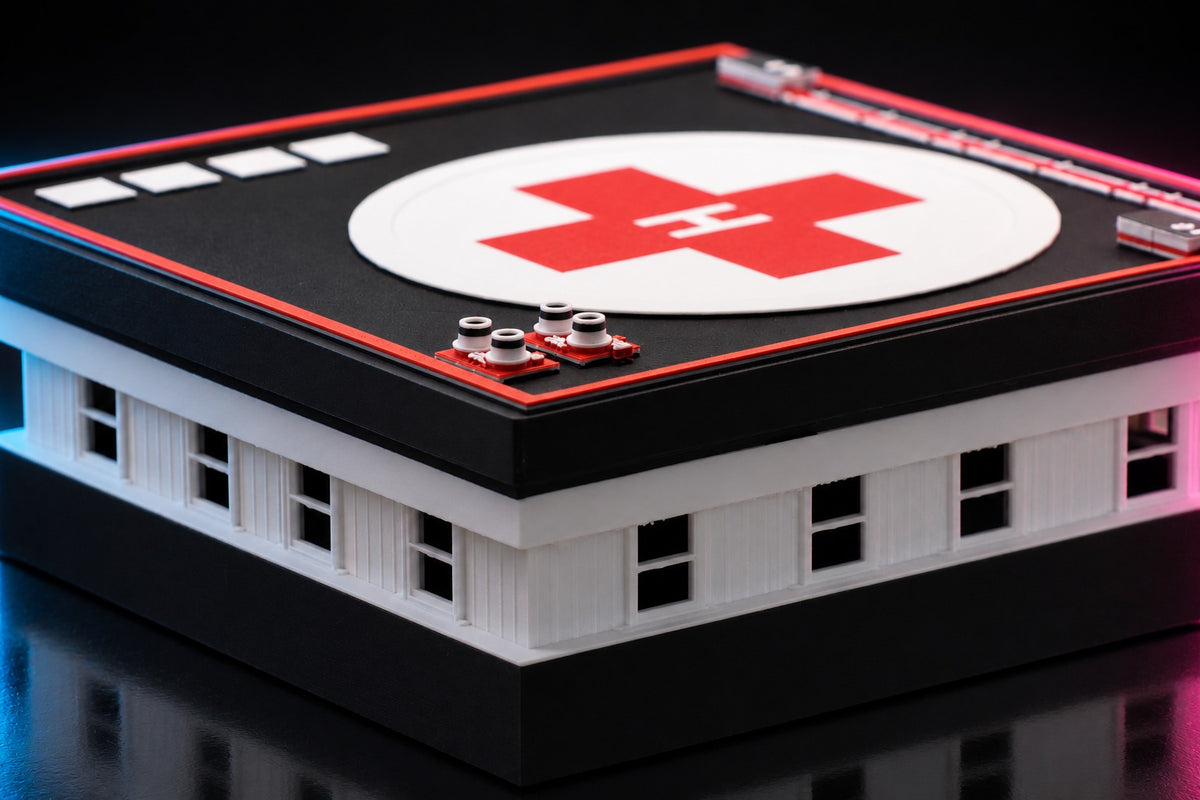 Close-up of the hospital helipad, red cross with H marking and rooftop equipment