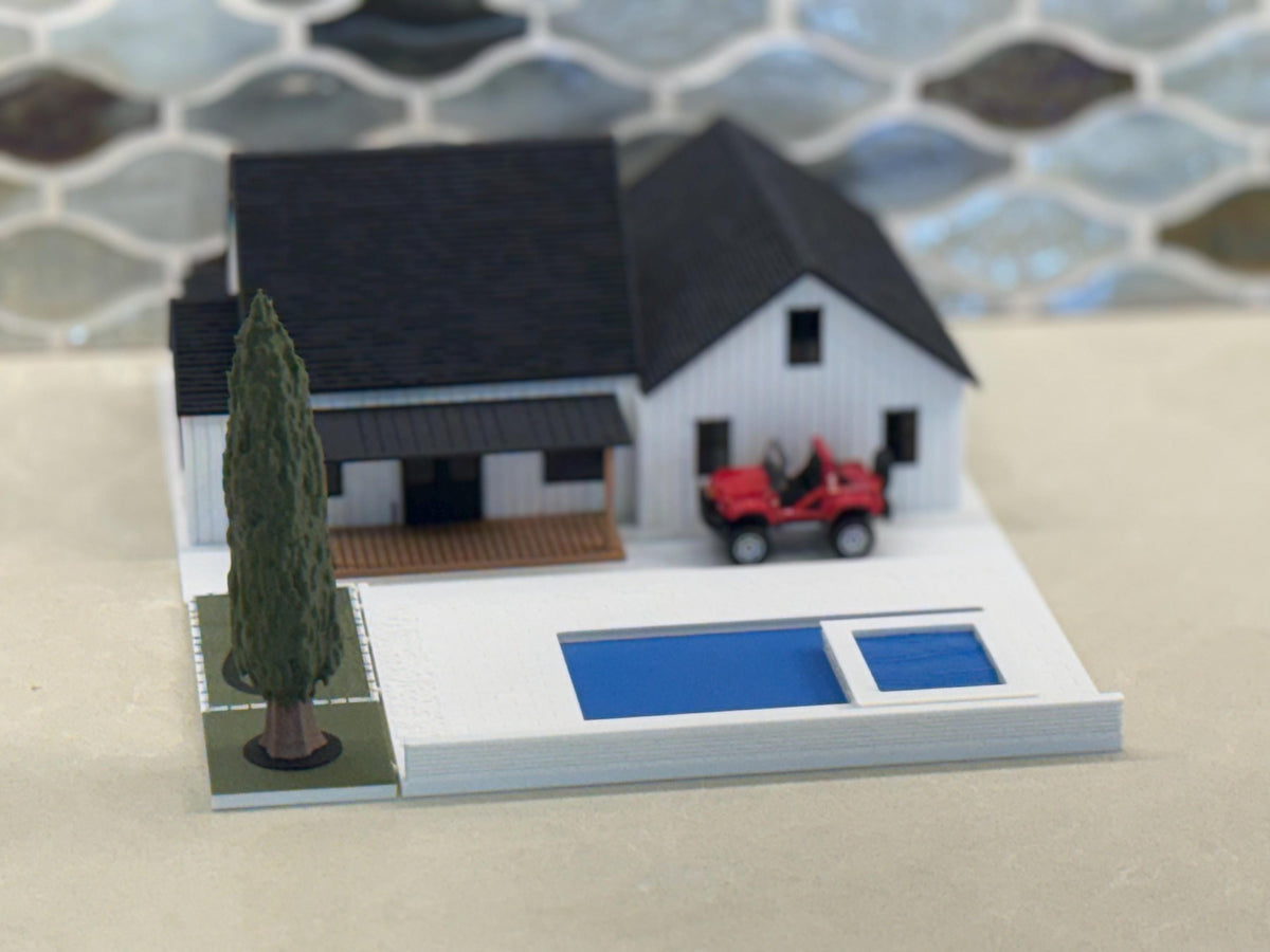 Back of the 1:64 modern farmhouse with the pool, cypress tree and a red diecast car