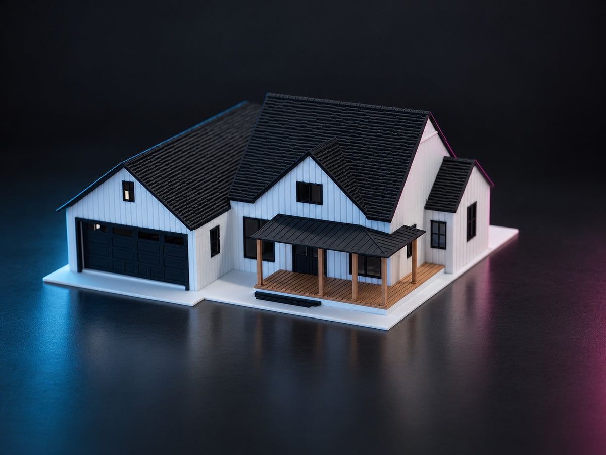 Three-quarter view of the 1:64 modern farmhouse diorama, black tiled roofs and covered porch
