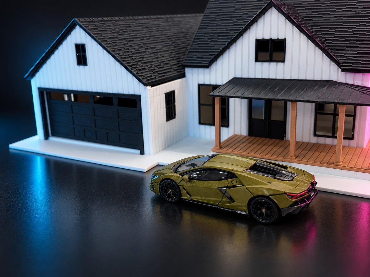 Olive diecast supercar in front of the 1:64 modern farmhouse garage and porch