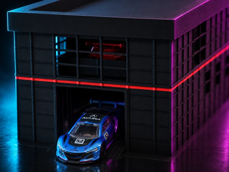 Frame 4 — close on one bay, a blue GT car under the roller door with the red stripe raking across the face.