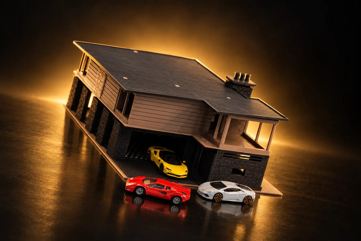 Tahoe Modern at an angle with the garage open: a yellow car inside, a red car and a silver car on the apron.