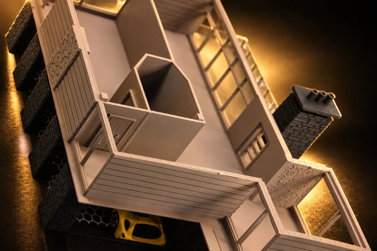 The upper floor with the roof off, from above: the partitions, an interior door and the long window wall.